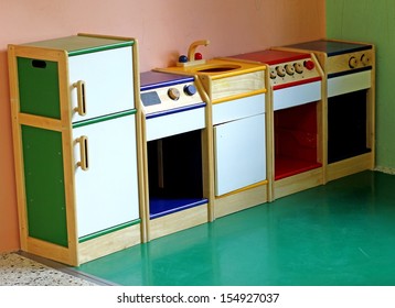 Small Wooden Toy Kitchen To Play And Amuse The Children Of A Nursery