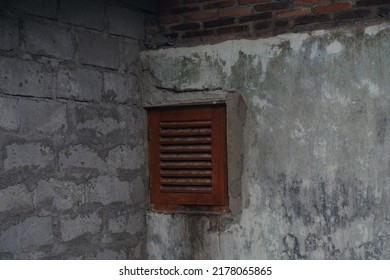 Small Wooden Window At The Back Of The House That Serves To Let Air Flow In