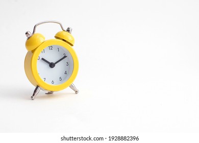 Small Yellow Alarm Clock With Bell Isolated On White Background