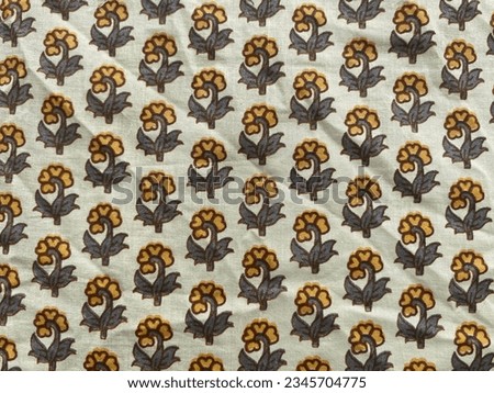 Small yellow flower motif block printed on Jaipuri cotton fabric 