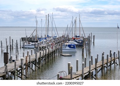 The Smallest Port Of The German North Sea Island Of Sylt In Rantum With A View Of The Wadden Sea, The Coast And Distant Wind Turbines