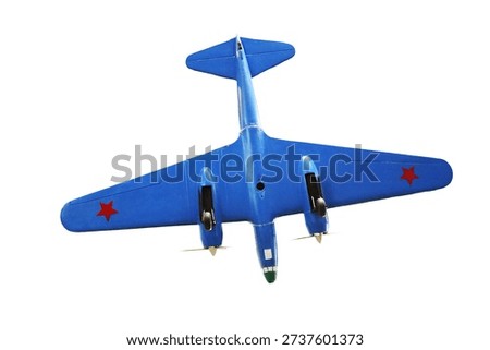 A small-scale model of an airplane flying through a clear blue sky, no clouds or obstacles visible.