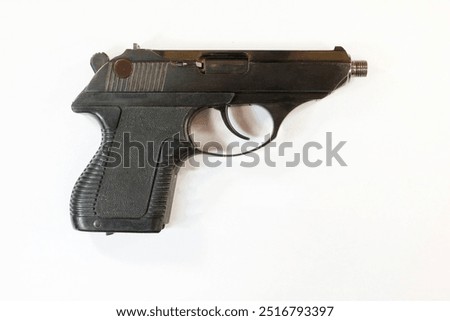 Small-sized self-loading pistol of 5.45 mm caliber on a white background