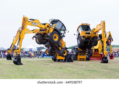 SMALLWOOD, CHESHIRE -  MAY 29th 2017: Dancing JCB diggers putting on a show at smallwood Vintage Rally, UK MAY 29th, 2017