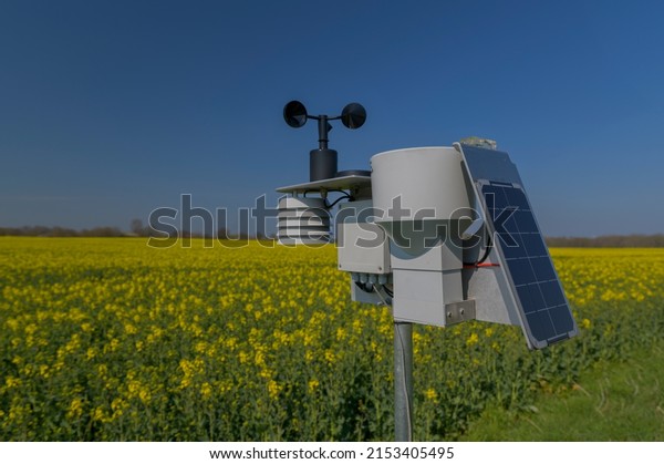 Smart agriculture and smart farm technology.\
Meteorological instrument used to measure the wind speed and solar\
cell system in the raps field. Weather station with solar panel\
placed in the field.