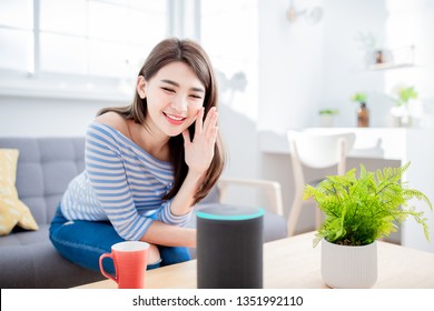 Smart AI Speaker Concept - Young Woman Talk To Voice Assistant At Home And Feel Happy