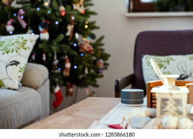 Smart Ai Speaker With Man Cooking In The Background. Smart Home Concept During Christmas Holiday Winter Time