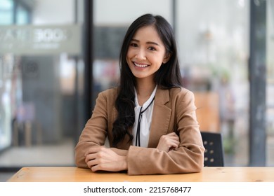 Smart asian business woman smiling at office space. real estate, lawyer, non-profit, marketing - Shutterstock ID 2215768477