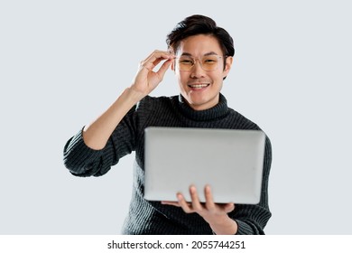 Smart Attractive Asian Mature Adult Male Wear Glasses Hand Using Laptop Online Working Studio Shop White Background,man Wear Sweater  Casual Cloth Smiling Confident And Positive Emotion