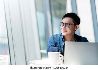 Smart Attractive Positive Asian Business Male Wearing Glasses Work Remote New Normal Lifestyle Hand Use Laptop Tele Conference Onlive Videocall Meeting Remote Business Ideas Concept