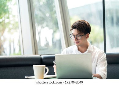 Smart Attractive Positive Asian Business Male Wearing Glasses Work Remote New Normal Lifestyle Hand Use Laptop Tele Conference Onlive Videocall Meeting Remote Business Ideas Concept