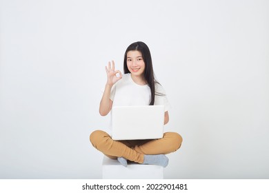 Smart Attractive Young Woman Use Laptop Computer Sitting Cross Legged On Gray Studio Background