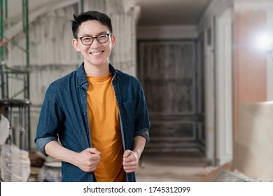 smart attrative handy glasses asian male craftman or interior designer focus wood working at site constrution home interior design renovation and improvement concept