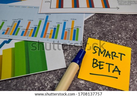 Smart Beta write on sticky notes isolated on Office Desk. Stock market concept