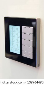 Smart black switch panel with screen for home or office - close up