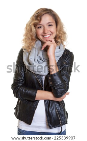 Smart blond woman in a leather jacket