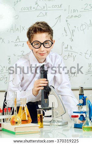 Similar – Image, Stock Photo boy is making science experiments in a laboratory