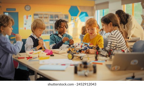 Smart Boys and Talented Girls Playing with Scientific and Engineering Toys. Young Gifted Future Engineers Studying Science, Engineering, Math and Technology in Primary STEM School - Powered by Shutterstock - Get 15% off with code: PIKWIZARD15