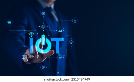 Smart business IOT, internet of things concept. Businessman touching IOT icon on virtual screen, connected internet network to access AI intelligence, business analytics, internet investing. - Powered by Shutterstock