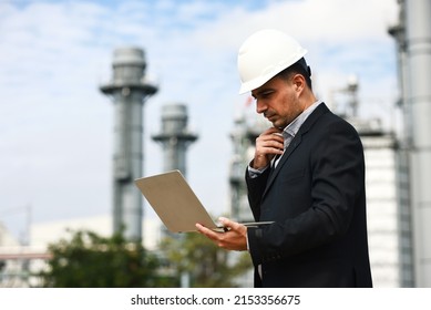 Smart business man concentrate working laptop at site line Cogeneration power plant   Engineering   business investment  concept