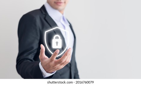 Smart Business Man In A Suit Standing Holding A Shield Protection Icon Security Protection Computer Your Data Network Concept