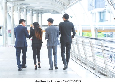 Smart Business People Team Or Colleagues Talking Together While Walking To Meeting Entrepreneurs. Group Of Secretary Or Lawyer Discuss Prosecutions. Consultant,Financial,advisor,law Accounting Concept