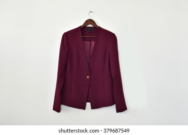 Smart Business Women's Blazer On A Hanger Isolated On White Wall Background, With Lot Of Empty Space For Text 