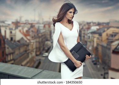 Smart businesswoman on the roof of the building