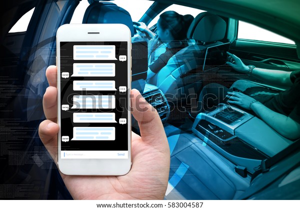 Smart car ,\
chatbot and internet of things (IOT) concept. Hand holding smart\
phone and icons popup out of\
screen.