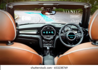 Smart Car (HUD) And Augmented Reality Navigation Technology Concept. Empty Cockpit In Vehicle And Self-Driving Mode Car Graphic Screen.