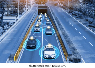 Smart car (HUD) , Autonomous self-driving mode vehicle on metro city road iot concept with graphic sensor radar signal system and internet sensor connect. - Shutterstock ID 1253551390