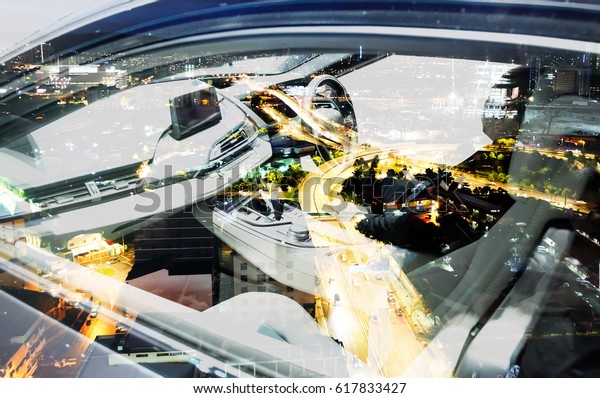 Smart car (HUD) and Self-Driving mode car\
concept. Double exposure of luxury car and driver with city night\
light background.