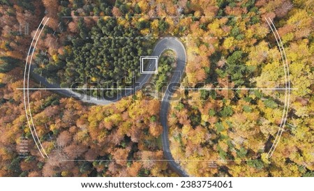 Smart car for intelligent self driving on winding road through the autumn forest. Futuristic HUD display elements satellite car surveillance and identification monitoring target vehicle