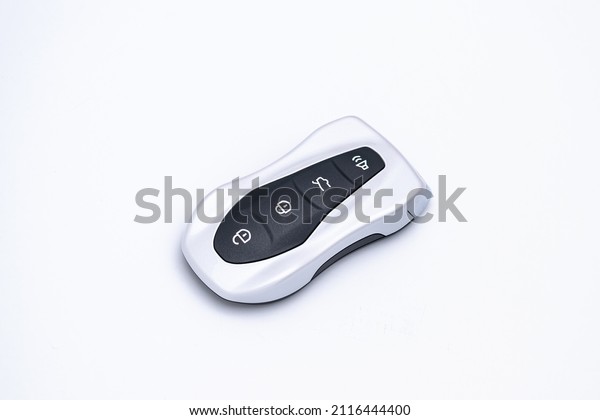 Smart car key on a white\
background. Electronics, spare parts and car accessories.\
Horizontal photo.