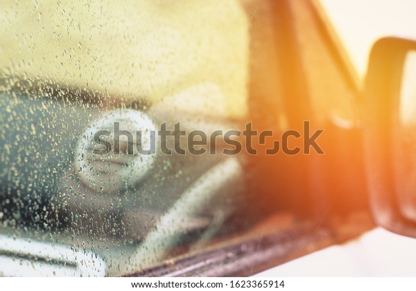 \
Smart\
car mirror. Raindrops. Black and white mini\
car.