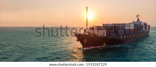 Smart cargo container  ship at\
sunset import export container concept freight shipping sea\
port.