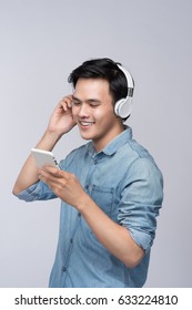 Smart Casual Asian Man With Headphone In Studio Background