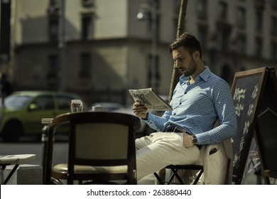 Smart Casual Outfit Man At A Coffe Shop Reading The News Paper