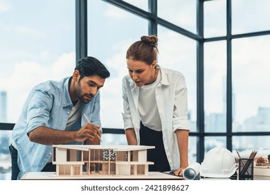 Smart caucasian architect engineer team working together to measure house model. Group of professional interior designer brainstorming and sharing ideas about design building construction. Tracery. - Powered by Shutterstock