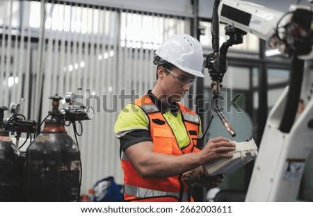 Smart Caucasian engineer work setup AI automated in robotics electronics engineering laboratory. Technician inspector maintenance repair check robot arm machine in artificial intelligent laboratory.