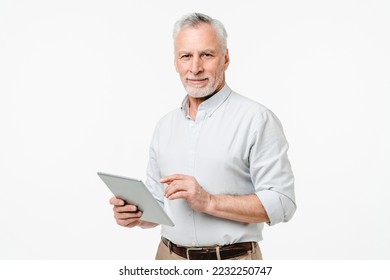 Smart caucasian mature middle-aged senior freelancer grandfather ceo boss teacher professor using digital tablet for remote work online, watching webinars isolated in white background