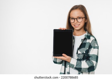 Smart Caucasian Preteen Teenage Girl Schoolgirl Using Digital Tablet Showing Device Screen Mockup For Mobile Application Isolated In White Background