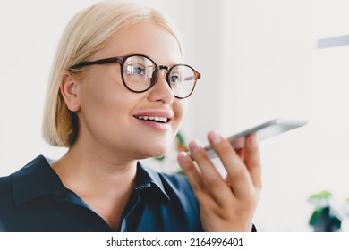 Smart Caucasian Young Businesswoman Teacher Ceo Boss Freelancer Recording Voice Message Online On Cellphone, Talking Communicating With Friends Colleagues, Ordering Food Delivery
