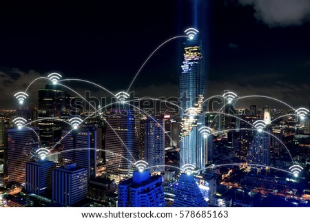 Smart city and wireless communication network, business district with office building, abstract image visual, internet of things concept.