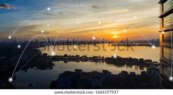 Smart city and wireless communication network\
concept. Digital network connection lines of Hanoi city at West\
Lake or Ho Tay