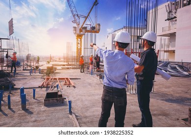 Smart civil architect engineer inspecting   working outdoors structure building site and blueprints  engineering   architecture concept 