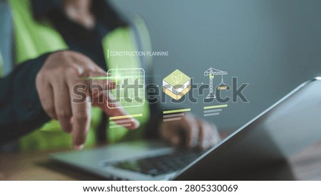 Smart construction planning concept worker pointing at laptop digital hologram of architectural blueprint eco friendly building materials and construction workflow sequence for sustainability