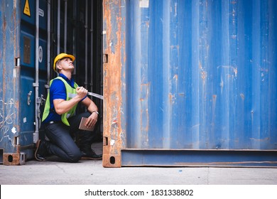 Smart creative foreman engineer man using digital tablet control loading containers box from cargo freight ship for import export. Logistic, Transportation, import and export concept. with copy space
