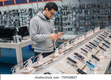 Smart Customer Choosing Smartphone In The Mobile Phone Shop. Difficult Decision. Various Choice.