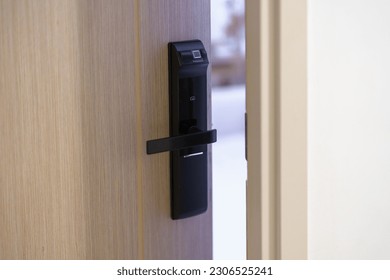 smart digital door lock while open or close the door at home or apartment. NFC Technology, Fingerprint scan, keycard, PIN number, smartphone, electrical and contactless lifestyle concepts